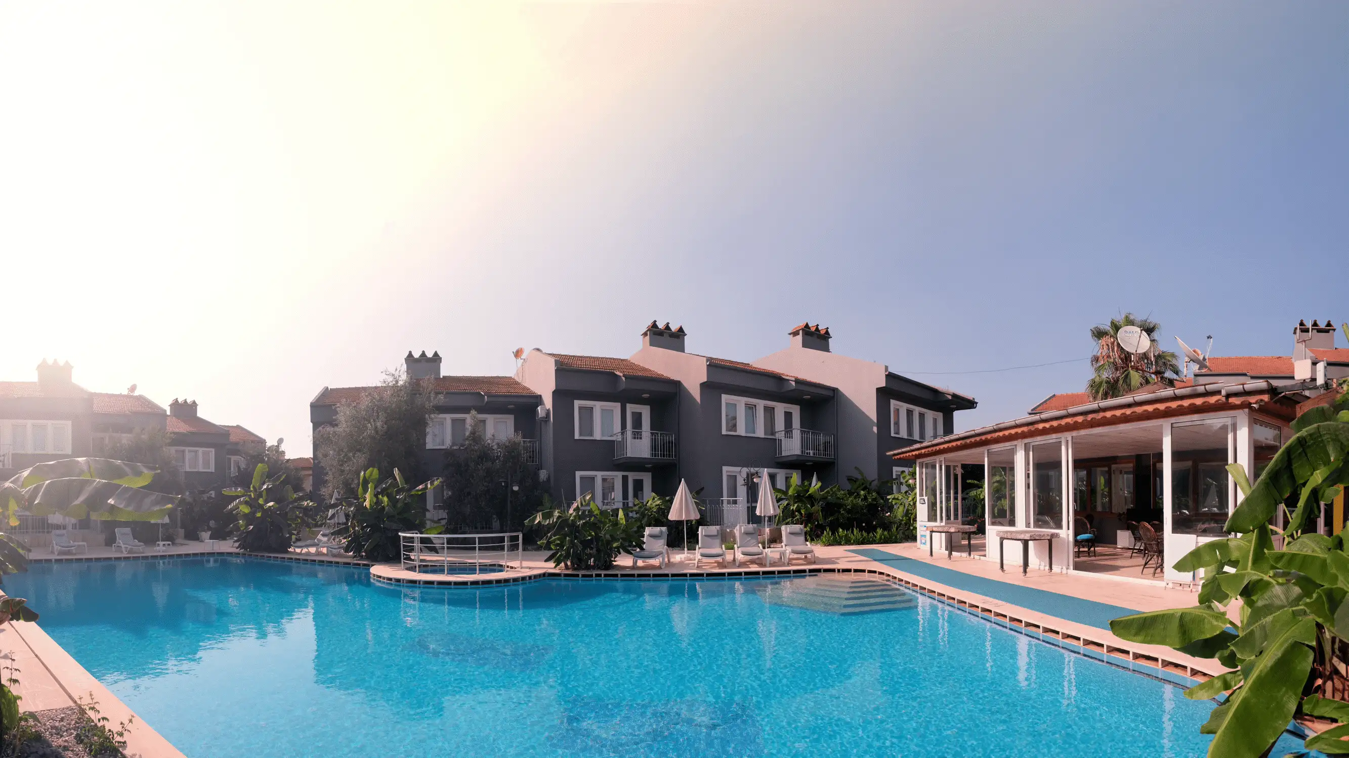 Özcem Apart Hotel — Panoramic pool view and apartment blocks